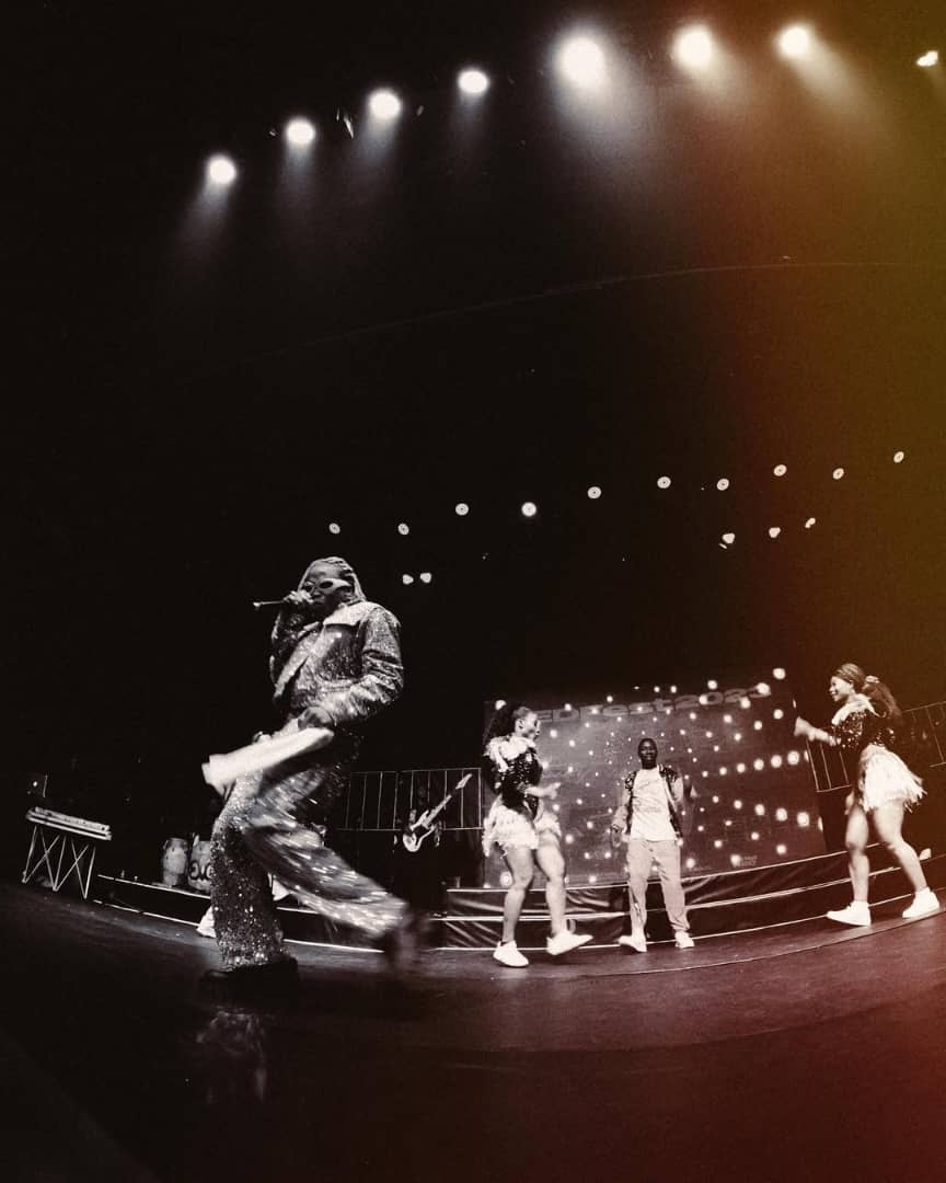 Live performance under stage lights — directed by Drtonez