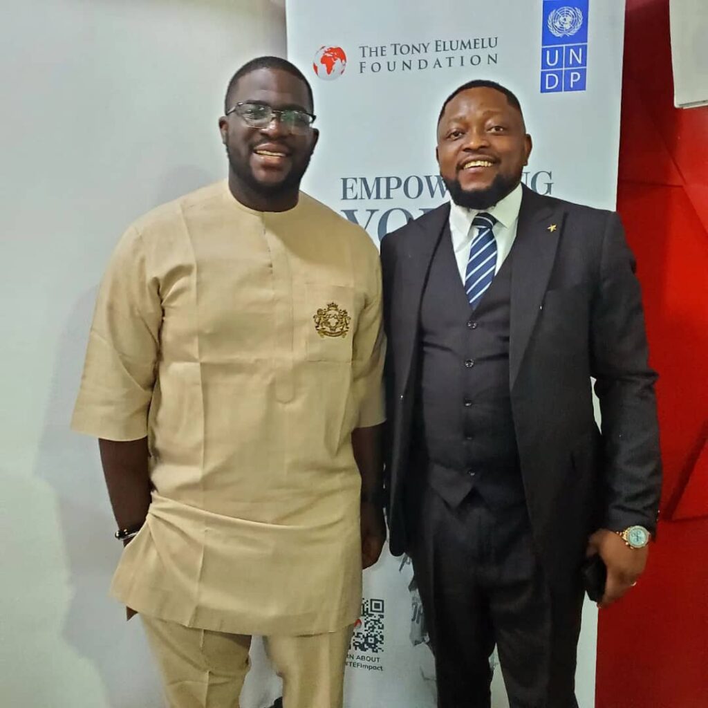 Drtonez standing beside the UNDP Partnership Lead at a policy, economic, and entrepreneurship development review meeting organized by the Tony Elumelu Foundation.