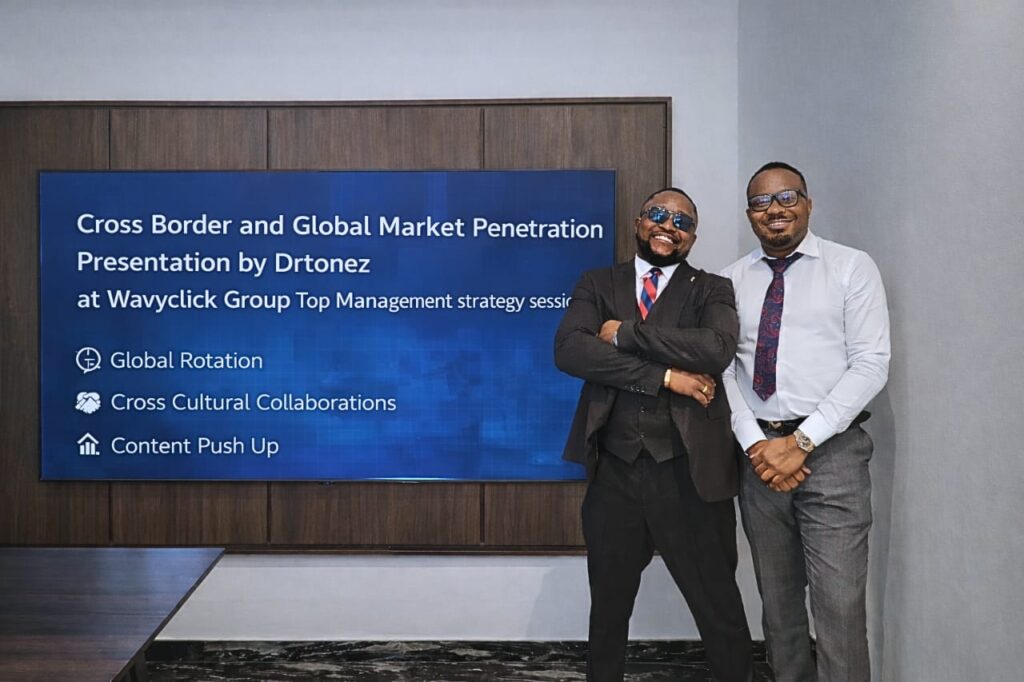 “Drtonez, Group Executive Business Lead, with the CEO of Wavyclick Group at a Top Management Strategy Session”